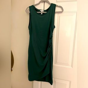 Dark green sleeveless dress with scrunching on the left side size 8 there you go
